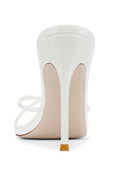 Back view of the Donatella 100 in Patent White showing the backless mule silhouette and self-covered stiletto heel