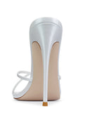 Back view of the Donatella Mule in Patent White showing the backless mule silhouette and self-covered stiletto heel