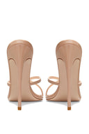 Femme LA Donatella Mule in Nude – back pair view, nude patent heel counters, slim stilettos, crossed straps visible from behind