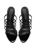 Kalós Slipper in Patent Black - front view of the pair showing the open pointed toe and multi-strap design
