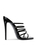 Kalós Slipper in Patent Black - side view highlighting the glossy patent finish and slip-on silhouette