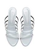 Kalós Slipper in Patent White - front view of the pair showing the open pointed toe and multi-strap design