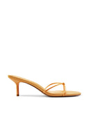 Maeve Slipper in Orange - side view of satin kitten-heel mule with knotted strap and open toe